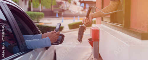 Scan and pay for food, pick up food from a drive-thru counter and take it to eat at home and at work.	
