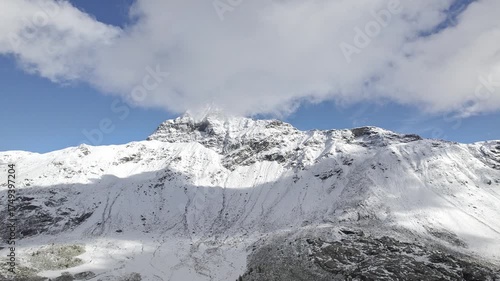 The pyramid of Pizzo Scalino with avalanche, drone view in the winter season