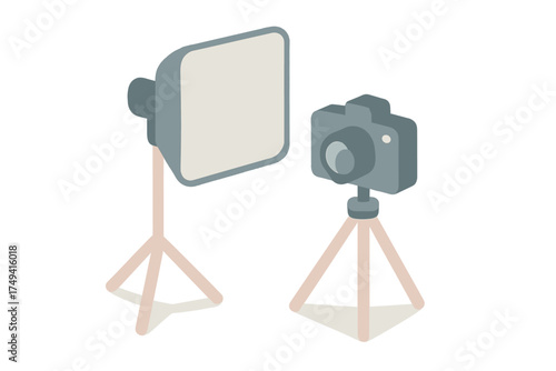 Professional photography studio equipment setup with digital camera tripod and softbox light