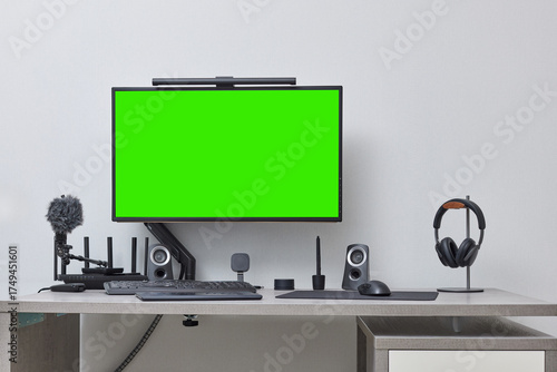 modern comfortable workspace for remote work. empty green computer pc and setup for freelancer from home office