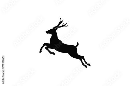 A leaping deer captured in a striking black and white silhouette