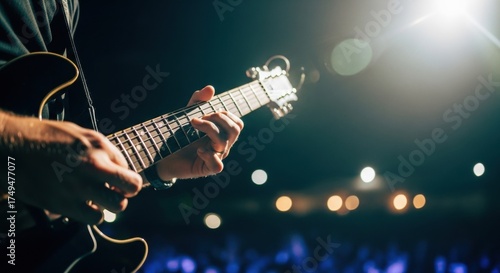 Energetic Guitarist's Hands Playing Electric Guitar on Stage, Illuminated by Dramatic Spotlight and Bokeh