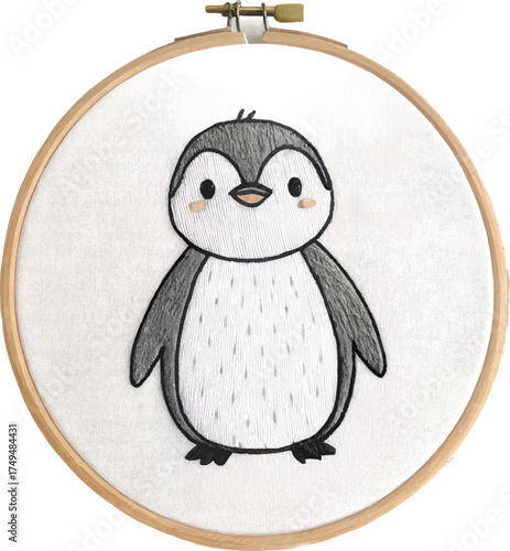 Charming embroidered penguin in hoop art, perfect for nursery decor or a handcrafted gift, showcasing a cute and playful design, a delightful addition