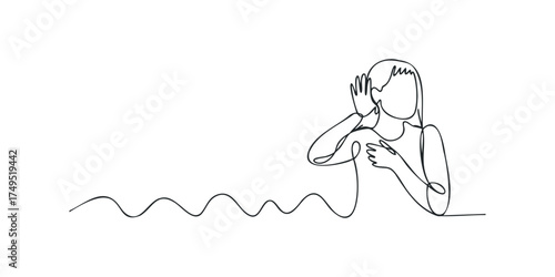 Woman holding hand to ear, listening attentively