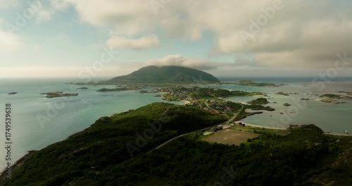 Aerial riser reveals scenic Sommaroya summer island in Kvaloya, Norway