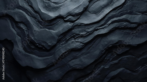 Dark crumpled paper rock texture with deep folds and shadows