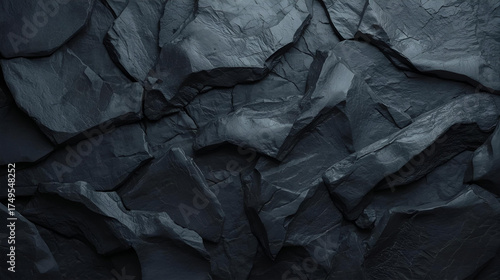 Dark rough stone rock texture with natural cracks and surface