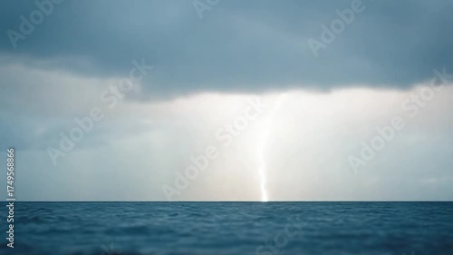 Dramatic Ocean Scene with Stormy Clouds and Sun Rays Breaking Through.