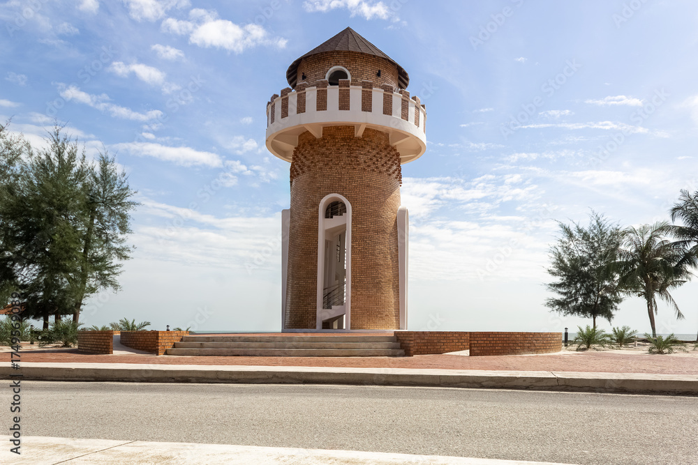Fototapeta premium Peaceful Park by the Sea with Concrete Bench and watch tower View in Pantai Kempadang, Kuantan Pahang, Malaysia