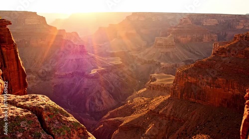 sunrise colorful - A breathtaking view of a canyon at sunset, with warm sunlight filtering through iconic rock formations and casting shadows that enhance the natural beauty of the landscape