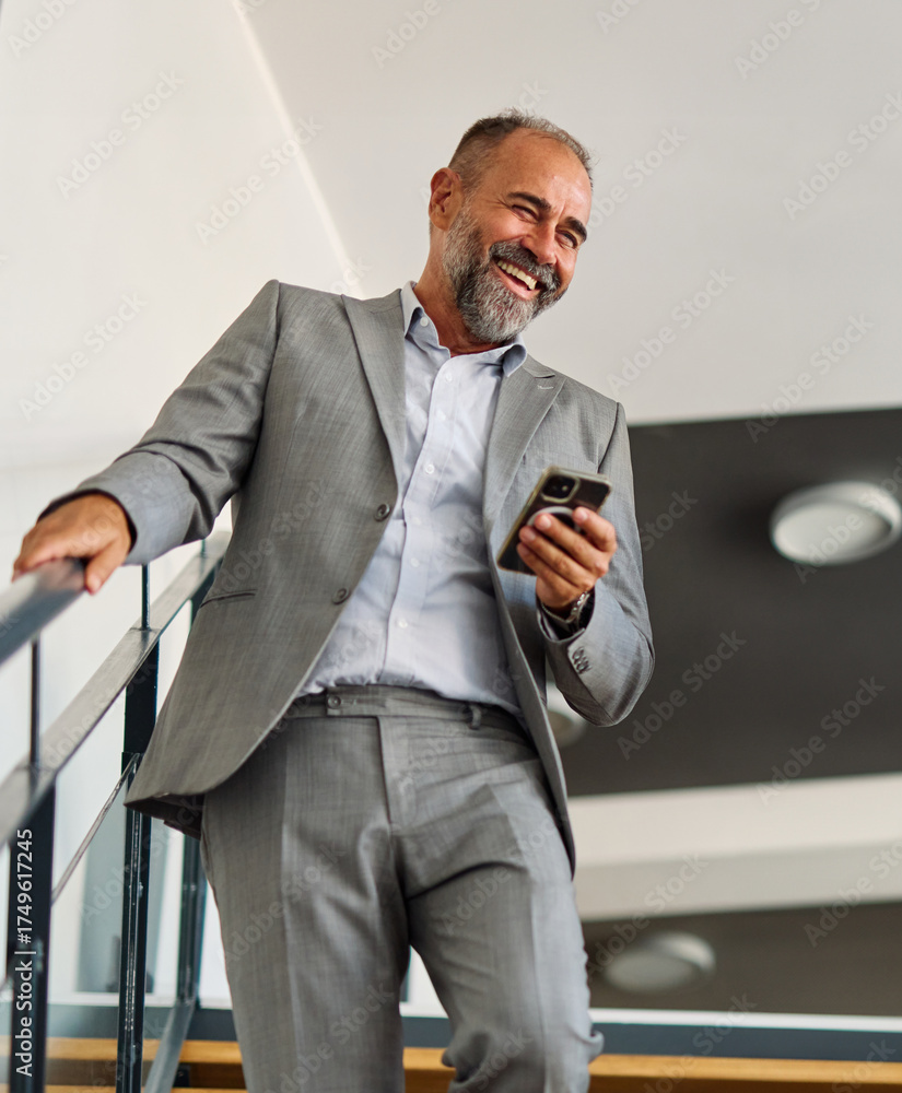 Naklejka premium A man in a blue shirt is standing in office, businessman portrait