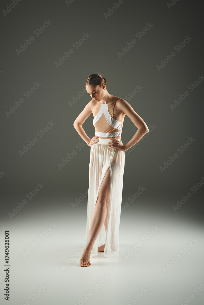 Fototapeta premium Graceful ballet performance by a young woman in a minimalist setting