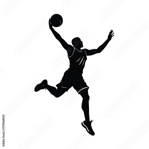 Silhouette of a basketball player dunking a ball jumping