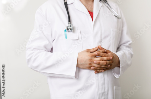 A doctor in a white coat wi...