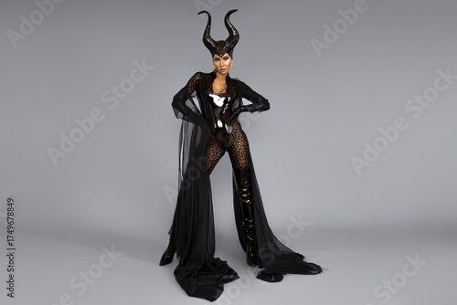 Canvastavla Dark queen with black horns and red lips in dramatic Halloween portrait Witch wi