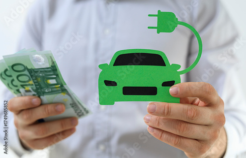 Person holding money and el...