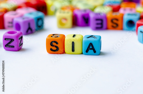 SIA text on multicolored cube representing Social Impact Assessment. Conservation concept.