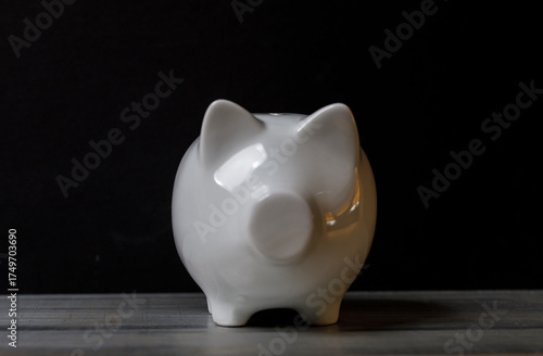 A white piggy bank sits on ...
