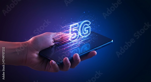 A hand holding a smartphone displaying a glowing 5g symbol, representing the next generation of mobile network technology and its highspeed connectivity