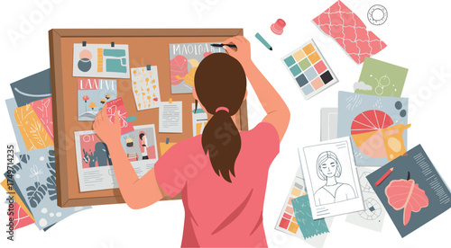 Woman working on a creative mood board with sketches and color palettes