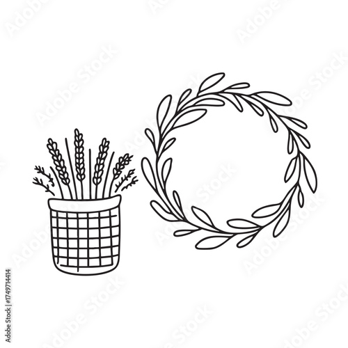 A wreath beside a basket filled with dried flowers
