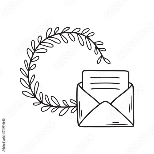 A wreath beside a handwritten card tucked underneath