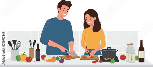 Couple cooking together, chopping vegetables in kitchen