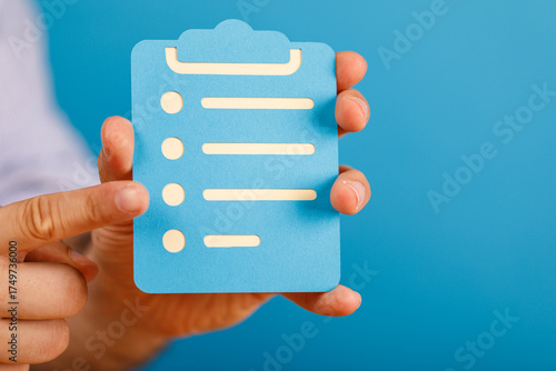 Person's hand pointing at a...