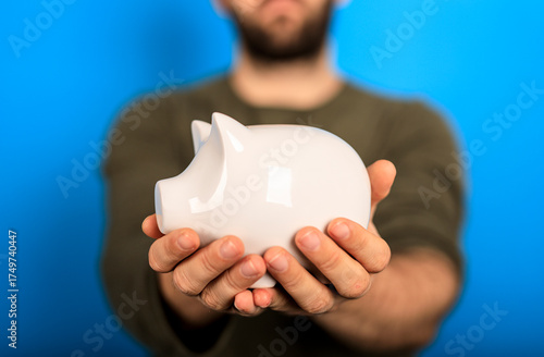 Person holding a white pigg...