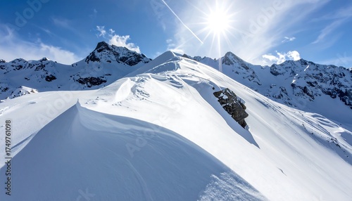 Snowy Mountain Peaks Under Sunny Sky.