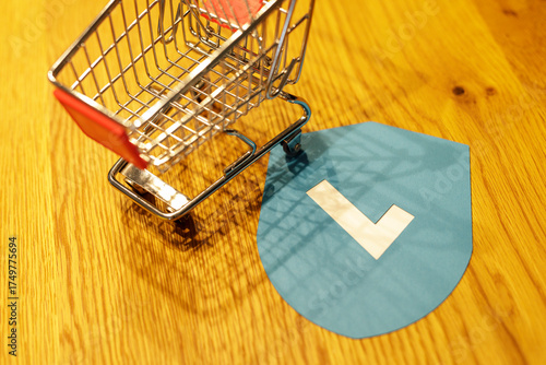 Shopping cart and shield ic...