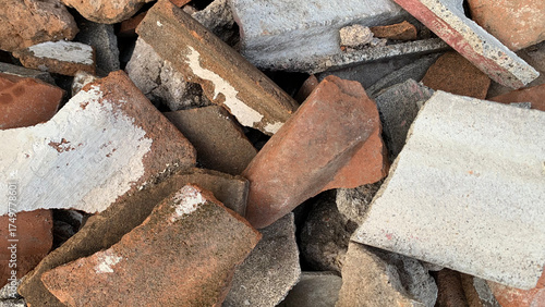 Detailed full-frame background of a rugged exterior wall constructed from rough gray concrete blocks joined by thick, overflowing white cement mortar. Construction concept