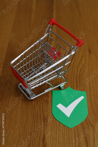 A shopping cart with a gree...