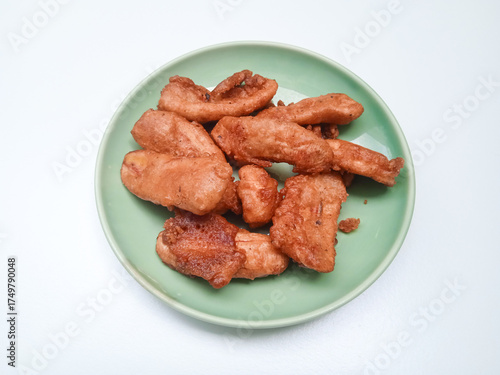 Crispy Thai fried banana ripe slices coated in coconut batter, deepfried to golden perfection. A sweet, crunchy street snack loved for its tropical flavor and texture.