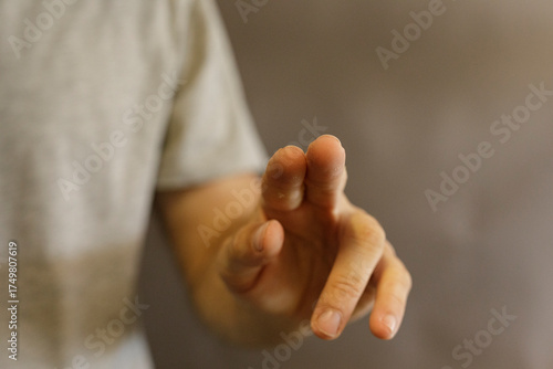 Image of a hand pointing wi...