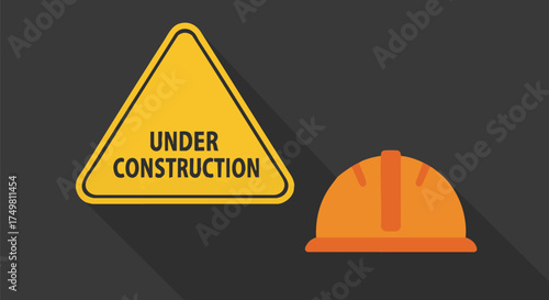 A vibrant yellow under construction warning sign and an orange safety hard hat symbolize ongoing development and workplace safety protocols.