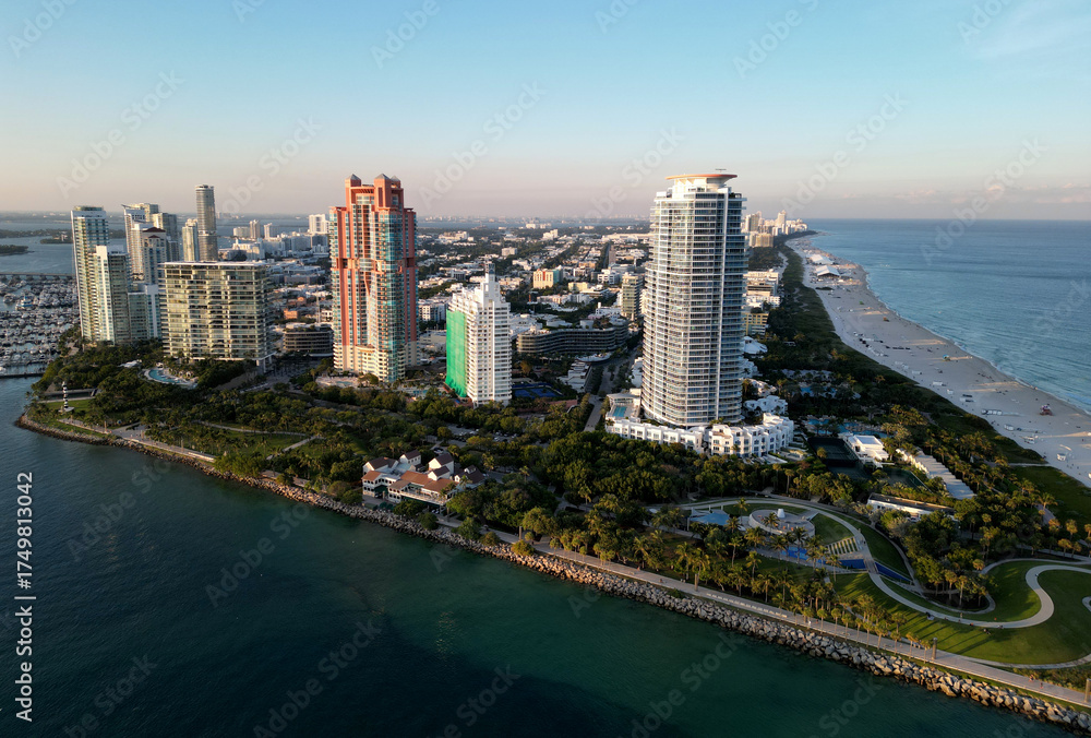 Fototapeta premium Miami cityscape with luxury skyscrapers and ocean. Panoramic view of Miamis famous skyline. Miami Beach from above. Miami skyline from top. Aerial cityscape of Miami, Florida.
