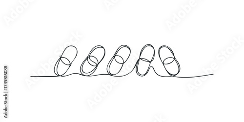 Continuous line drawing of pills on a white background
