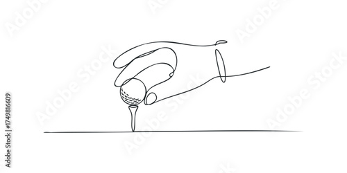 Hand placing golf ball on tee