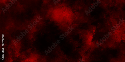 Abstract explosion of red powder on black background, freeze motion of red particles splashing, red color clouds aerial view of a forest fire with vibrant flames and smoke.