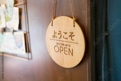 open sign hanging on the wall of a small cafe. Small business concept , soft focus .