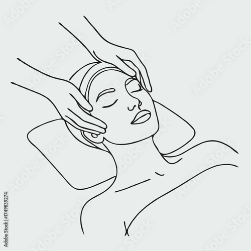 Woman receiving facial massage with hands on her face  