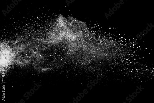 White powder explosion on black background.