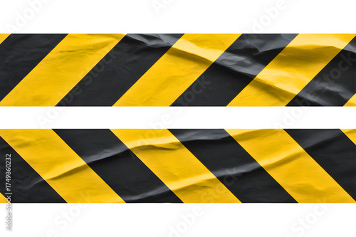 Warning tape with black and yellow diagonal stripes, indicating danger or caution. Hazardous symbol to alert people to potential risks