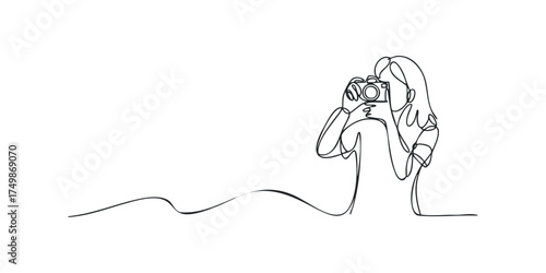 Continuous line drawing of a person holding a camera