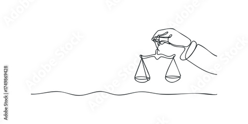 Hand holding scales of justice