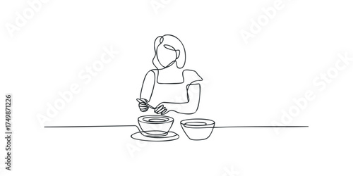 Person stirring food in bowl using spoon