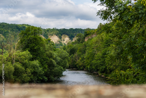 View from Historic Bridge in Amt-Creuzburg over Werra River to Ebenauer Köpfe, Germany