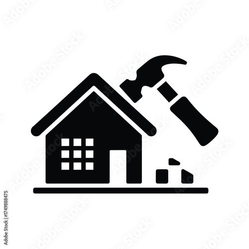 Silhouette of a house being demolished with a hammer and debris