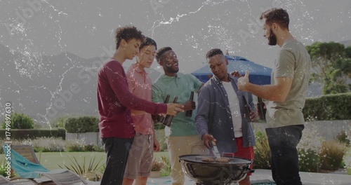 Grilling group of five friends turning meats on charcoal grill at poolside patio, with summer wear